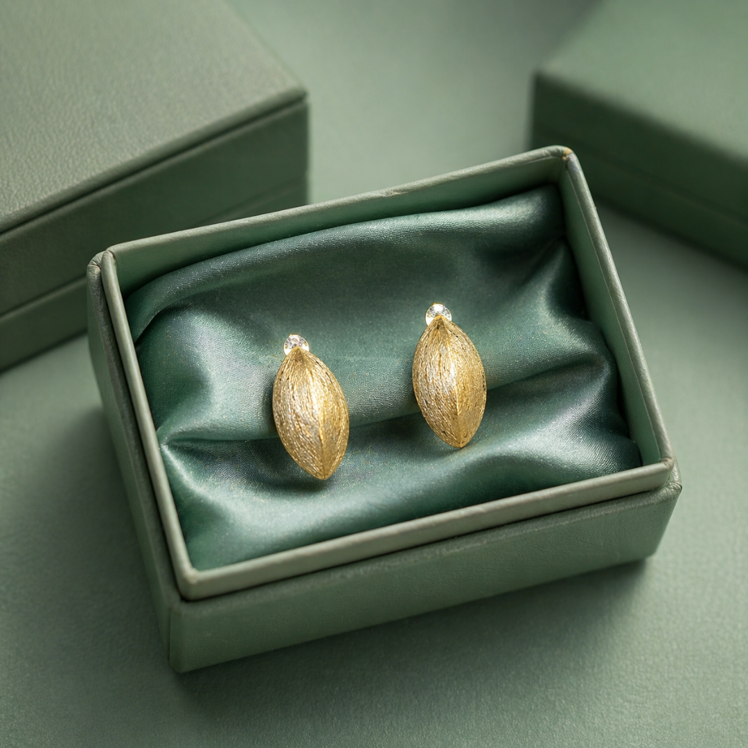 Textured leaf gold stud earrings in 925 sterling silver by Sinara Silver Studio